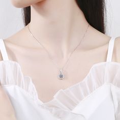 This Water Drop Heart Moissanite Necklace Pendant brings sparkle and elegance to any outfit. Crafted with sterling silver and a genuine Moissanite gemstone, this pendant has a radiant cut stone that is sure to turn heads. The perfect accessory for any occasion. Product Details: Material: 925 Sterling Silver Stone: Moissanite Diamonds/D /1 carat Weight: 2.54g Length: 45cm Pendant Diamond Height: 6.5mm SKU: AN23102304 Keywords: moissanite chain, moissanite necklace, moissanite pendant, moissanite Wedding Silver Diamond Necklace With Birthstone, Elegant Sparkling Heart Pendant Jewelry, Silver Moissanite Heart Pendant Necklace, Silver Cubic Zirconia Crystal Necklace As Gift, Silver Cubic Zirconia Crystal Necklace For Gift, Silver Solitaire Necklace With Birthstone, Silver Pendant Birthstone Necklace For Wedding, Silver Crystal Clavicle Necklace With Heart Pendant, Silver Solitaire Necklace With Flower Pendant