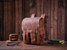 Personalized Daily Backpack, Handmade Full Grain Leather Backpack, Travel Backpack, Laptop Backpack, Men Leather Rucksack, Best Men Gift Personalization We can engrave any picture, initials, name, or logo etc on any location.  Please send picture with Etsy message and leave a note at checkout with what you would like personalized on. Features: 1. Heavy full Grain Leather, about 2.3kg in weight 2. Cotton inside lining,Brass hardware, Magnetic buttons 3. Inside zipper pocket, laptop sleeve,cell po Everyday Carry Backpack With Adjustable Strap, Waxed Finish Satchel Backpack For School, Leather Bag For Outdoor And Back To School, Back To School Leather Outdoor Bag, Leather Bags For Back To School Outdoor Use, Leather Backpack With Adjustable Strap For Back To School, Backpack Handmade, Daily Backpack, Everyday Backpack