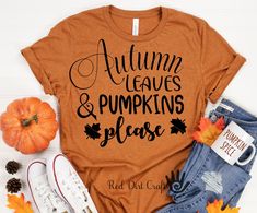 a t - shirt that says autumn leaves and pumpkins please next to some fall leaves