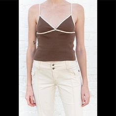 Cotton Crossover Lace Trim V-Neck Tank Top With A Seam Under The Bust. Fabrics: 100% Cotton Measurement: 18.5" (47 Cm) Length, 14" (36 Cm) Bust Made In: China Tops Brandy Melville, Brown Tank Top, Black Cropped Tank, V Neck Tank Top, Tank Girl, Brandy Melville Tops, Cream Lace, Girls Fashion Clothes, Striped Tank Top