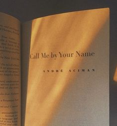 an open book with the title call me by your name written on it's cover