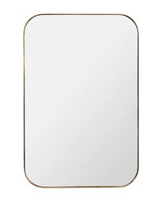 a square mirror with a gold frame on the wall, isolated against a white background