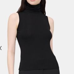 One Girl Who Sleeveless Turtleneck Perfect Turtleneck To Style By Itself Or Underneath A Jacket Or Sweater! Nwot! 92% Nylon 8% Spandex Approximate Measurements L 24.5” Pit To Pit 20” Smoke And Pet Free Home E Spring Black High Neck Tank Top, Black High Neck Tank Top For Spring, Black Turtleneck Tank Top For Spring, Chic Black Turtleneck Tank Top, Spring Sleeveless Elastane Vest, Black Turtleneck Tank Top For Fall, Trendy Stretch Vest, Casual Sleeveless Elastane Top, Fitted Turtleneck Tank Top Casual