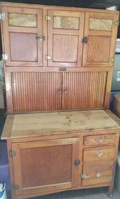 an old wooden cabinet sitting on top of a floor