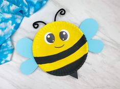 a paper plate that has a bee on it