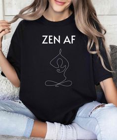 This Comfort Colors Yoga T-shirt makes a funny and unique gift to a friend who enjoys yoga or to enjoy as a meditation shirt. This Yoga Tshirt Lotus design added to the ZEN AF text is sassy and fun. .: The Comfort Colors 1717 tee is made with medium fabric (6.1 oz/yd² (206.8 g/m consisting of high quality, 100% ring-spun US cotton for long-lasting comfort. .: The relaxed fit keeps the wearer comfy in both casual and semi-formal settings while the crew neckline delivers that classic, neat style which makes it perfect for accessorizing.  .: The pre-shrunk fabric ensures a consistently great fit. Check all available sizes in our Comfort Colors 1717 size chart.  .: All Comfort Colors 1717 shirts feature pre-shrunk cotton for size retention and a signature sewn-in twill label. .: Made using 100 Relaxed Fit Graphic Print Tops For Meditation, Relaxation Graphic Print Crew Neck Top, Graphic Print Crew Neck Tops For Relaxation, Crew Neck Top With Graphic Print For Relaxation, Letter Print Yoga Tops, Yoga Crew Neck Tops With Graphic Print, Graphic Print Crew Neck Yoga Top, Casual Letter Print Yoga Top, Graphic Print Short Sleeve Tops For Yoga