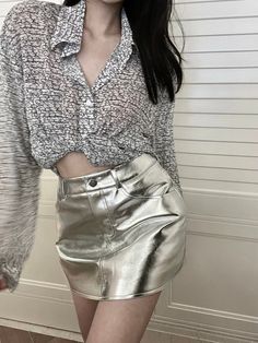 Shine brighter than a star in our Corine Metallic Mini Skirt! Whether you rock the silver or pink style, you'll be rocking like a rockstar! Make sure to twirl and show off the pleated accents of your skirt - it's guaranteed to turn heads. Sparkle and shine on! Gender: WOMENItem Type: SkirtsSilhouette: A-LINEMaterial: Faux LeatherElasticity: Non StretchDresses Length: Above Knee-LengthDecoration: Zipper SIZE CHART Model: 86/62/86 (34"/25"/34") wearing XS, Height 168cm/46kg Size Waist Hip Length X Metallic Mini Skirt, Like A Rockstar, A Line Shorts, Y2k Clothes, Pink Style, Straight Trousers, You Rock, Long Sleeve Knit Tops, Shine On