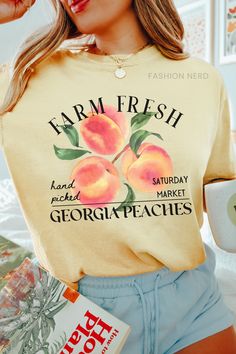 Dive into summer with farm-fresh georgia peaches, indulge in the softness of a Comfort Colors t-shirt. Whether paired with shorts for a beach day or dressed up with a skirt for a sunset soirée, this summer staple exudes both comfort and farmcore flair. 𝔻𝔼𝕋𝔸𝕀𝕃𝕊 Comfort Colors 1717 T-Shirt 💗Fabric content: 100% Cotton 💗Feel: luxe thick garment-dyed cotton 💗Fit: oversized unisex fit - Models are wearing XL Gildan 5000 T-Shirt 💗Fabric content: 100% Cotton; heathered colors have added polyester 💗Feel: tubular jersey knit cotton 💗Fit: standard unisex fit - Models are wearing L ➡️Direct to Garment Printing uses ink jet technology to spray ink onto garments for a strong bond between the ink and fibers. ➡️Kindly note that colors, contrast, textures and positions of graphics can slightl Farmers Market Shirt, Georgia Peaches, Support Local Farmers, Fruit Stand, Peach Shirt, Fit Models, Fruit Stands, Local Farmers Market, Fresh Market