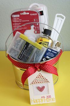 a gift basket filled with personal care items on top of a yellow table next to a white wall