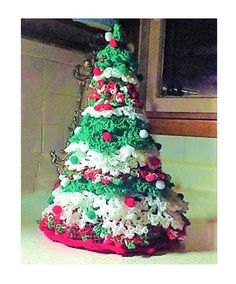 a christmas tree made out of rice krispy kreme and candy canes