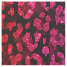 an animal print fabric with pink and red spots