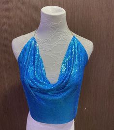 Beautiful chainmail top Gorgeous Blue colour  One size fits all - chain at back for sizing Blue Backless Party Top, Blue Backless Tops For Night Out, Glamorous Blue Sequined Tops, Backless Blue Halter Top For Party, Blue Backless Halter Top For Party, Blue Sleeveless Crop Top For Party, Sleeveless Blue Crop Top For Party, Blue Sleeveless Halter Top For Evening, Blue Sequin Top For Party Season