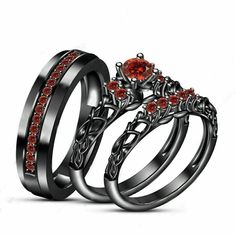 two wedding rings with red stones on each one and an engagement ring in the other