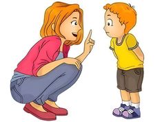 a woman kneeling down next to a little boy who is pointing at him with his finger