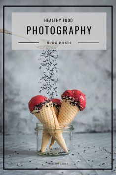 two ice cream cones with sprinkles coming out of them in a jar