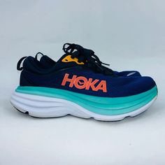 Hoka Womens Bondi 8 Navy/Turquoise Blue Comfortable Running Shoes Size 7b Msrp: $165 Design: * Vegan, Engineered Mesh Upper Made With Recycled Content * Recycled Content Lining * Partially Gusseted Tongue * Heel Pull Tab For Easy On-And-Off * Extended Heel With Billowed Grooves Provides Smoother Transitions In-Shoe Comfort: * More Precise Internal Collar Foam For Enhanced Comfort * Othrolite Hybrid (Recycled) Sockliner * All-New Lightweight, Resilient Foam Midsole Durability & Traction: * Durabr Blue Low-top Sneakers With Removable Insole, Blue Low-top Sneakers With Ortholite Insole, Blue Running Shoes With Air Cushioning, Blue Running Shoes With Ortholite Insole For Errands, Functional Blue Sneakers For Everyday Use, Functional Blue Sneakers For Running Errands, Functional Blue Sneakers, Blue Running Sneakers With Ortholite Insole, Blue Slip-on Running Shoes With Rubber Sole