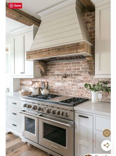 a stove top oven sitting inside of a kitchen next to white cabinets and counter tops