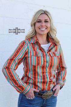 Inspired by the vibrant colors of a rodeo, the Sturgill Serape Button Up is not just a simple shirt. With beautiful orange and teal stripes, it brings a bold and energetic touch to your wardrobe. Show off your love for any occasion with this unique and stylish piece. 92% Polyester & 8% Spandex Sizing chart is located in the pictures. Wild Rag, Sweater Blazer, Simple Shirts, Plus Size Shopping, Wholesale Clothing, Sizing Chart, Rodeo, Long Sleeve Sweater, Jumpsuit Romper