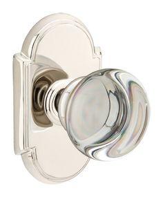 an image of a chrome door handle with glass knobs on the front and side