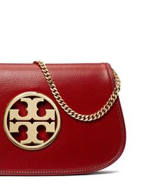 Add glamor to your outfits while keeping your essentials close with the iconic Reva Clutch from Tory Burch. This signature bag is crafted from lightweight leather with a convenient magnetic closure and interior lining for daily use. Stylish gold double T hardware and foldover design keep your look polished wherever the day takes you, while allowing quick access to must-have items on the go. Discrete and chic, the Reva Clutch elevates any ensemble for the Instagram worthy fashionista. Look Polished, Tory Burch Bags, Instagram Worthy, Tory Burch Bag, Must Have Items, Personal Shopping, Free Bag, Women's Bags, Magnetic Closure