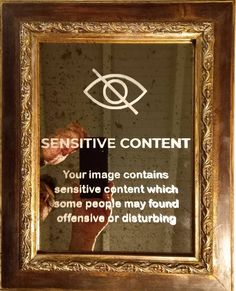 a sign on the side of a building that says, sensitive content your image contains negative content which some people may found offensively or distoring