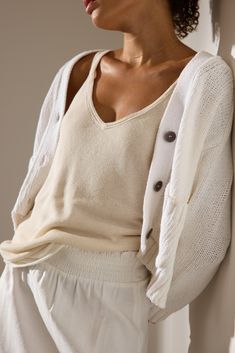 A new, sure to become a classic, Brochu Walker silhouette, our Cropped Cardigan has a button front placket and boxy fit that make it 100% effortless. In an Italian, novelty-tape, linen/cotton yarn it has a subtle two-toned effect that adds dimension and surface interest. Special details like raglan sleeves that are shaped to look perfect worn down or pushed up, patch pockets for versatility, wide ribbing on the cuffs and hem and our signature exposed back seam, make this a staple with a twist. Brochu Walker, Cardigan White, White Cardigan, Color Free, Cropped Cardigan, Linen Women, V Neck Sweater, Raglan Sleeve, Cotton Yarn