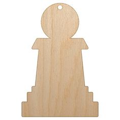 a wooden cutout of a person standing in front of a white background with the shape of a chess piece