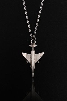 Embrace your love for aviation with our F4 Phantom Aircraft Necklace, a unique piece of jewelry that pays tribute to the iconic fighter jet. Handcrafted with meticulous attention to detail, this necklace is perfect for both men and women who appreciate the art of flight. Whether you're a seasoned pilot, an aviation enthusiast, or simply someone with a taste for wanderlust-inspired jewelry, this aircraft necklace will seamlessly blend with your style and passion. Our F4 Phantom Aircraft Necklace Boho Necklaces Bohemian, Necklace Airplane, Airplane Jewelry, The Art Of Flight, Plane Necklace, Gothic Necklaces, New Year Jewelry, Necklaces Minimalist, Airplane Necklace