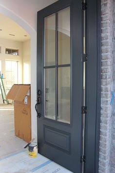 an image of a door in the middle of a room that has been painted gray