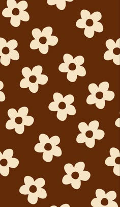 a brown and white flower pattern with small flowers on the bottom half of the image