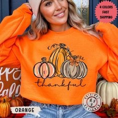 This trendy watercolor thankful Thanksgiving pumpkin crewneck sweatshirt is pure comfort. Combining soft cotton and quality print elements make users fall in love with it over and over again. These garments are made from polyester and cotton. This combination helps designs come out looking fresh and beautiful. The collar is ribbed knit, so it retains its shape even after washing. There are no itchy side seams on these sweaters. .: Made with a medium-heavy fabric blend of 50% cotton and 50% polyester (8.0 oz/yd² (271.25 g/m this sweatshirt feels cozy and is the perfect choice for those colder months. .: The classic fit along with the crew neckline deliver a comfy wearing experience with a clean-cut style. Meanwhile, the double-needle stitching at the shoulder, armhole, neck, waistband, and Orange Crew Neck Sweatshirt For Fall, Orange Cotton Sweatshirt For Fall, Trendy Orange Sweatshirt For Fall, Thanksgiving Letter Print Crew Neck Top, Thanksgiving Sweatshirt, Thanksgiving Sweatshirts Vinyl, Thankful Sweatshirt, Casual Thanksgiving T-shirt With Graphic Print, Thanksgiving Graphic Print Crew Neck T-shirt