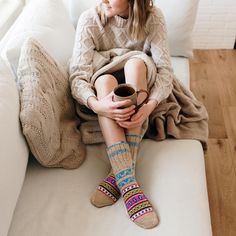 Inspired by the colors and flavor of chai tea, a warming drink served on street corners in India. Women artisans living in Himalayan communities hand-knit these cozy, calf-length slipper socks from a long-lasting "vegan" yarn. S: fits women's size 8 to 9.5/fits men's size 7 to 8.5 M: fits women's size 9.5 to 11/fits men's size 9 to 10.5 Himalayan Valley Knitters is a Fair Trade certified organization, and each item you purchase helps to support local orphanages. Hygge Fashion, India Women, Chai Tea, Knitted Slippers, Activewear Sets, Winter Warmers, Long Black Dress, Jumpsuit Shorts Rompers, Slipper Socks