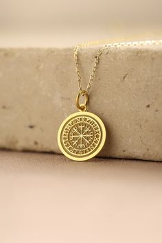 Gold Viking Compass Pendant - Viking Compass Gold Necklace ● Material of pendant: Solid Gold 14k ( REAL GOLD ) ● Metal Stamp: 14k ( REAL GOLD ) ● The pendant is available in 5 sizes: - 12,7 mm / 0.5 inches (Diameter) - 14,0 mm / 0,55 inches ( Diameter ) In the photos - 15,3 mm / 0.6 inches ( Diameter ) - 16,5 mm / 0,65 inches ( Diameter ) - 19,1 mm / 0,75 inches ( Diameter ) ( In the photos the size is 14mm / 0.55 inches Diameter ) ( Jump Ring inner diameter: 4 mm ) ● Material of chain: Solid go Commemorative Amulet Necklaces With Round Shape, Compass Design Pendant Jewelry As Gift, Amulet Style Commemoration Necklace With Round Shape, Compass Design Pendant Jewelry Gift, Symbolic 14k Stamped Necklace As Gift, Amulet Style Jewelry With Compass Design As A Gift, 14k Gold Compass Design Jewelry Gift, Symbolic 14k Stamped Necklace For Gift, Gold Amulet Necklace With Compass Design