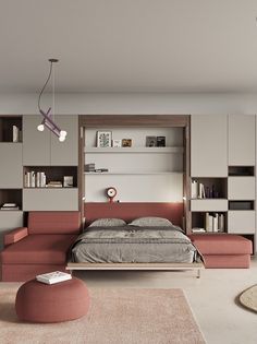 a bedroom with a bed, couch and bookshelf