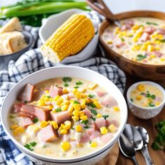 two bowls of corn chowee on a wooden table