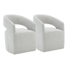 a pair of grey chairs sitting next to each other on top of a white floor