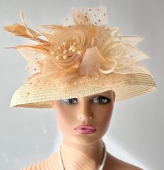 The featured listing is a dressy wide brimmed pale gold straw hat. A crinoline design in amber color sits at the side of the hat. Some sinamay, some feathers, amber netting also adorns the hat. All the elements combining  making the hat so interesting and softly dramatic. This  hat is  beautiful for the Kentucky Derby or  for  Sunday  Church.  It is also perfect for an Easter Hat, Tea Party hat,Wedding Party Hat, Fancy Dress Hat, Retro Hat, Downton Abbey hat, Audrey Hepburn style hat and any oth Luxury Pinched Crown Hat For Kentucky Derby, Luxury Cream Top Hat For Kentucky Derby, Luxury Cream Hat For Kentucky Derby, Wedding Dress With Wide Brim Hat, Crinoline Hats, Gold Straws, Hat Tea Party, Retro Hat, Easter Hat