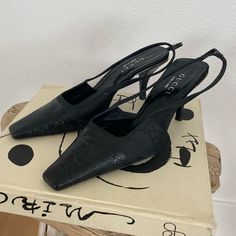 Absolutely Iconic Vintage Gucci Slingback Heels From 1998, The Tom Ford Era! Size 38. Heel Height Is About 3”. These Are Super Rare And A Collectors Item - I Can’t Find Another Pair Online Like Them (There Are A Few Of The Same Shoe In Different Colorways For $1-3k On 1st Dibs). Shoes Are Crocodile Leather On The Shoe Tips With The Iconic “Gg” Logo In Satin Fabric. Comes With The Original Box And Dust Bag! Really Great Condition - Only Noticeable Wear Is On The Soles. These Shoes Are The Original Version Of The Current Style Of Gg Slingbacks! Black Leather Gucci Slingback Pumps, Gucci Black Slingback Pumps With Branded Heel, Gucci Black Slingback Pumps With Heel Strap, Gucci Black Slingback Pumps, Black Gucci Slingback Pumps With Heel Strap, Gucci Spring Slingback Pumps With Heel Strap, Spring Gucci Slingback Pumps With Heel Strap, Gucci Slingback Pumps With Heel Strap For Spring, Spring Gucci High Heel Slingback Pumps