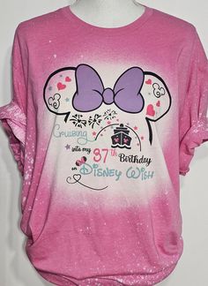 a pink shirt with minnie mouse on it