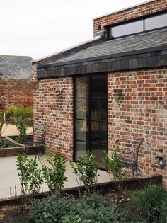 a brick building with an open patio area