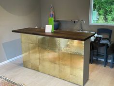 a kitchen island made out of metal and wood