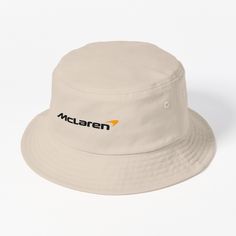 This packable, scrunchable, lightweight headwear classic is ready for adventure, from the beach to the street to the trail Breathable 100% cotton with eyelet ventilation Flat top Moderate brim is 2.2"" (5.5 cm) wide to keep the sun off your face Unstructured crown is 3.1"" (8 cm) deep Easy care: just spot clean and dry in shade. McLaren Logo Nf Motto, Mclaren Logo, Style Bucket Hat, Races Style, Black Bucket Hat, Black Bucket, Racing Team, Japanese Cars, Car Lover