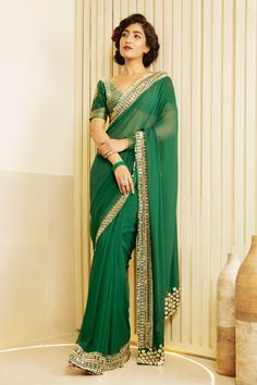 Emerald green saree with hand embroidered border in metallic gold and pearls. Comes with hand embroidered unstitched blouse piece.
Component: 2
Pattern: Embroidered
Fabric: Chanderi
Color: Green
Other Details: 
Note: Blouse worn by the model is not for sale
Occasion: Wedding - Aza Fashions Designer Party Wear Saree, Saree Women, Wedding Sarees Online, Designer Sarees Wedding, Latest Designer Sarees, Border Saree, Teal Blue Color, Party Wear Saree, Buy Sarees Online