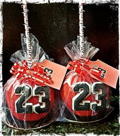 two red christmas balls wrapped in cellophane with the number 22 and twenty on them