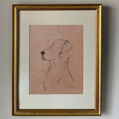 a drawing of a dog is hanging on the wall