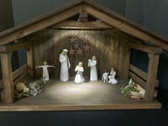 a nativity scene with figurines in the manger