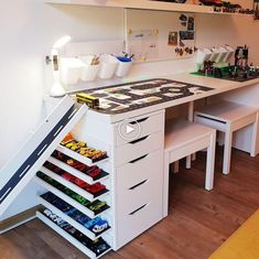 a white desk with drawers and shelves filled with various items on it's sides