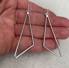 "Sleek, modern and cool! Here are some minimalist statement earrings. They have a simple modern design and would be perfect for everyday wear. The earrings measure 2 1/8\" long by 5/8\" wide. They hang from simple silver ear wire hooks. Overall drop length is 2 1/4\". Made from allergy free plated silver. Thanks for stopping by! Please take a moment and visit the rest of my Etsy shop. I have many more unique jewelry designs to choose from! 🌸 Tiger Flower Jewelry 🌸 🌸 Inspired by Nature 🌸" Modern Hypoallergenic Linear Earrings, Modern Geometric Ear Wire Earrings, Modern Geometric Nickel-free Earrings, Modern Nickel-free Triangle Earrings, Modern Nickel-free Geometric Earrings, Tiger Flower, Silver Earrings Long, Mod Earrings, Boho Hoop Earrings