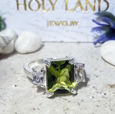 Don't miss this opportunity to own this beautiful gemstone ring crafted in 14k gold filled => Gemstone Type - Peridot, Clear Quartz => Gemstone Cut - Faceted => Gemstone Size - 8*10 mm, 3*5 mm => Total Number of Gemstones - 3 => Metal Type - 14k Gold Filled (Tarnish Resistant And Nickel Free) - also available in 925 sterling silver * Please contact me for pricing on a sizes larger than 11 * ~ Feel free to ask me about custom made designs. ❏ Replacements and custom orders : ✪ 925 s Peridot Three Stone Ring, Three Stone Peridot Ring Jewelry, Three Stone Peridot Ring, Three Stone Radiant Cut Ring For Gift, Radiant Cut Three Stone Ring Gift, Peridot Three Stone Jewelry As Gift, Three Stone Peridot Jewelry As Gift, Green Rectangular Stone Ring, Radiant Cut Three Stone Ring As A Gift