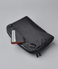 Stay agile and organized with this lightweight, packable travel sling. Easy-access pockets sort your essentials, the magnetic buckle makes on-and-off a snap, and the detachable strap can be removed to make it a pouch. Available in 1L and 2L sizes. Modern Nylon Travel Accessories For Commuting, Black Foldable Functional Shoulder Bag, Functional Foldable Black Shoulder Bag, Functional Black Foldable Shoulder Bag, Modern Nylon Travel Accessories With Zipper Pocket, Modern Nylon Travel Accessories For Outdoor, Black Nylon Travel Accessories With Zipper Pocket, Modern Nylon Travel Accessories With Functional Pockets, Versatile Black Rectangular Tech Accessories